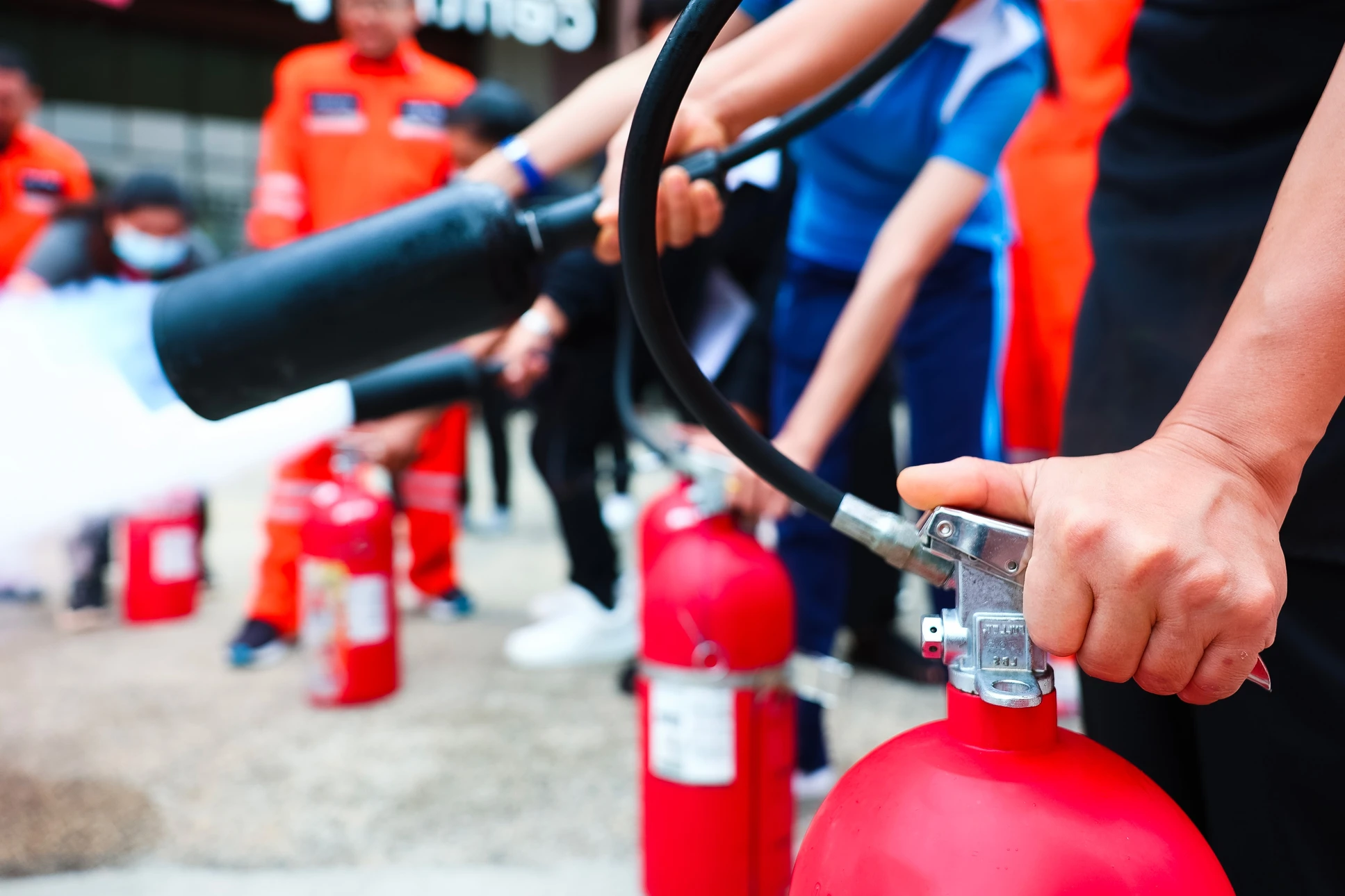 Uniformed fireman gives a lecture or instruction on fire safety